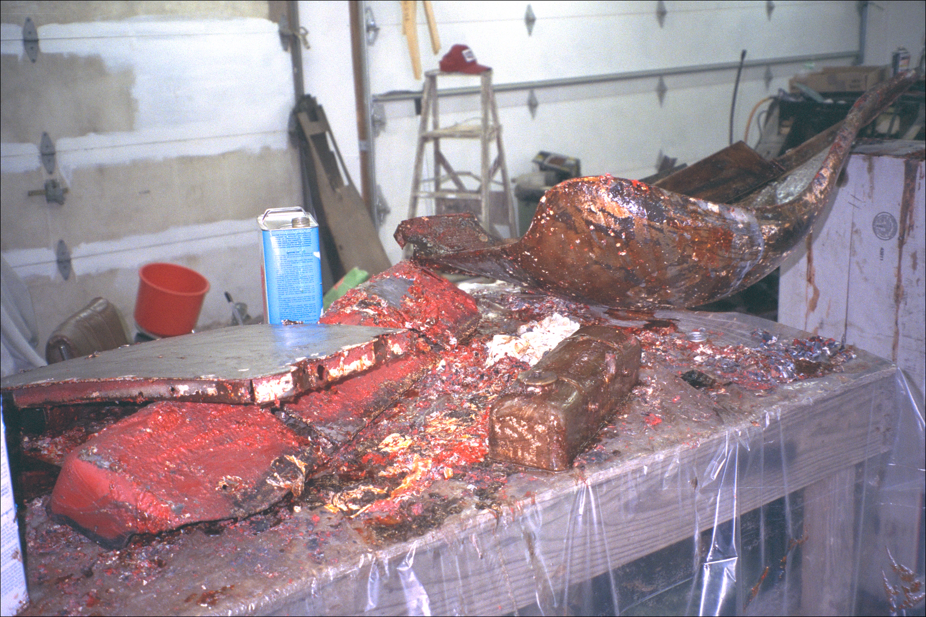 Stripping mess: door, rear splash pan, valve cover, wing